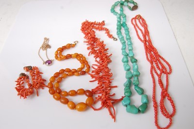 Lot 410 - A beaded and knotted butterscotch amber single...