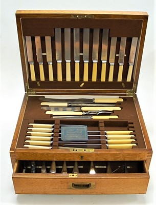Lot 271 - A 1920s oak cased six place setting canteen of...