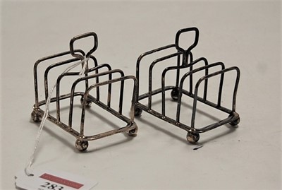 Lot 283 - A pair of Edwardian silver four-division...