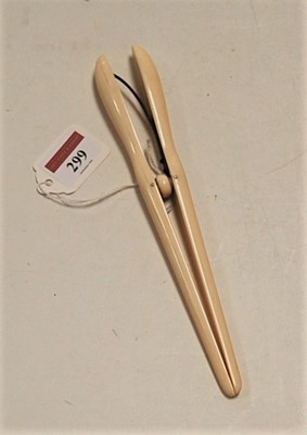 Lot 299 - A pair of early 20th century ivory...