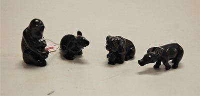 Lot 311 - A collection of four Japanese carved wooden...