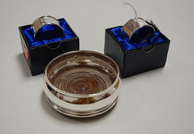 Lot 318 - A modern silver bottle coaster, of squat...
