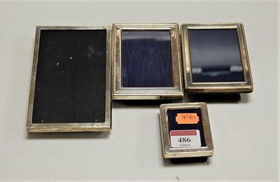 Lot 486 - Four various silver mounted easel photograph...