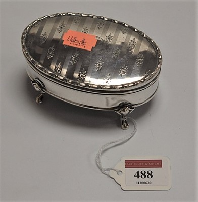 Lot 488 - An Edwardian silver trinket box, of oval form,...