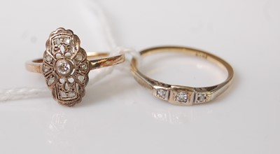 Lot 362 - Two yellow metal dress rings, composing an...