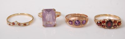 Lot 357 - Four 9ct yellow gold rings, comprising a...