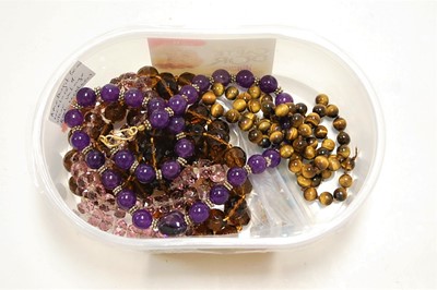 Lot 466 - An amethyst glass beaded necklace; together...