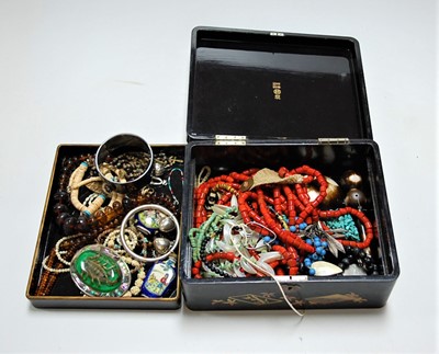 Lot 471 - A Japanese lacquered box and contents, mainly...