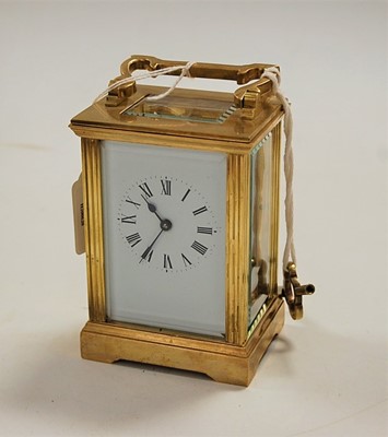 Lot 511 - A lacquered brass cased carriage clock, having...