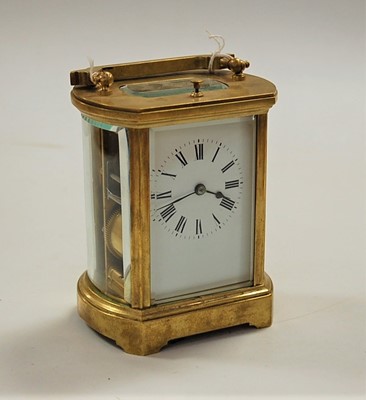 Lot 517 - A lacquered brass cased carriage clock, of...