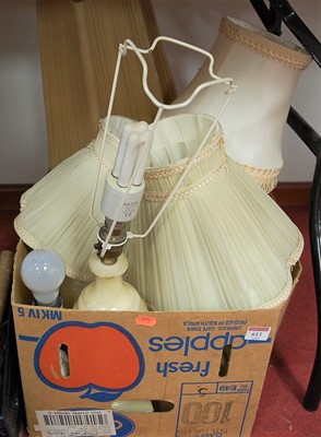 Lot 613 - A turned alabaster table lamp, with pleated...