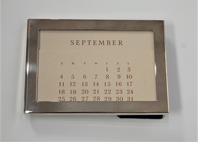 Lot 417 - A Tiffany & Co silver plated desk calendar,...