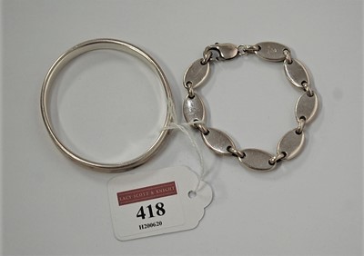 Lot 418 - A PROBABLY Tiffany & Co silver bangle, dated...