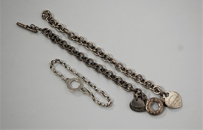 Lot 421 - Two Tiffany & Co 925 silver chainlink identity...