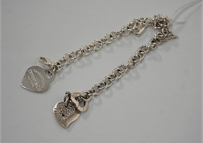 Lot 428 - Two Tiffany & Co 925 silver chainlink identity...