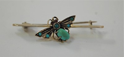 Lot 445 - A white metal and turquoise set butterfly bar...