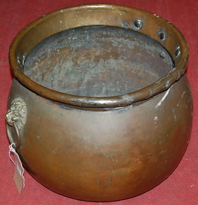Lot 1087 - A Victorian brass cauldron, having lion mask...