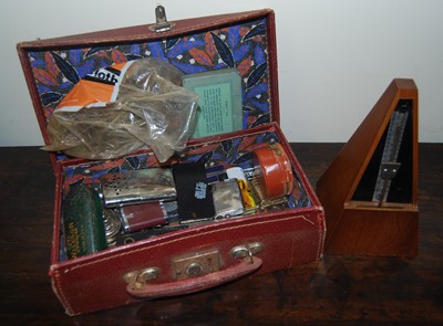 Lot 1581 - A vintage suitcase containing a quantity of...