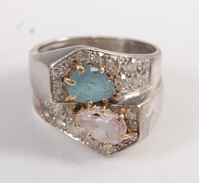 Lot 1192 - A white metal crossover ring, comprising a...