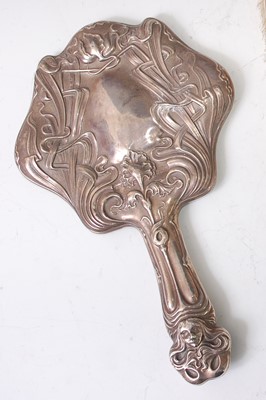 Lot 74 - An Art Nouveau silver hand-held dressing...