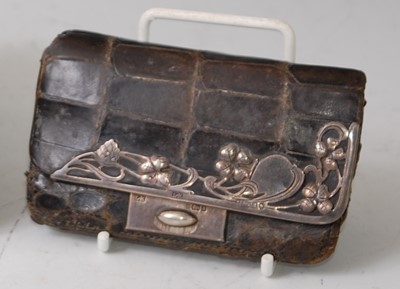 Lot 114 - An Art Nouveau crocodile skin and silver...