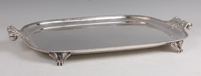 Lot 1103 - A circa 1900 silver plated twin handled tray,...