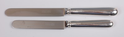 Lot 1112 - A set of eight modern silver handled table...