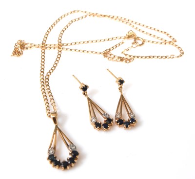 Lot 2502 - A 9ct yellow gold and sapphire pendant and...