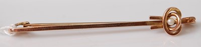 Lot 305 - A yellow metal stick pin, set with a 2.2mm...