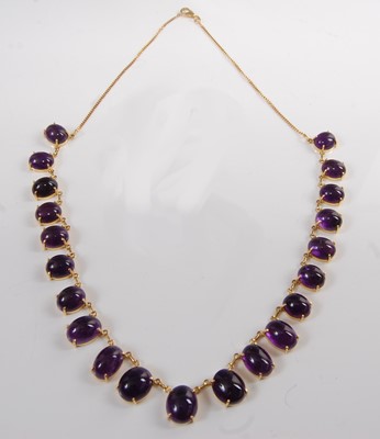 Lot 1219 - A yellow metal and amethyst fringe necklet,...