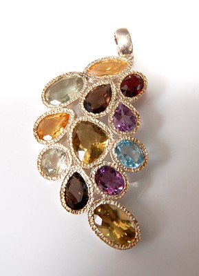 Lot 2541 - A sterling silver abstract pendant, comprising...