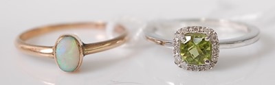 Lot 306 - A 9ct white gold, peridot and diamond cluster...