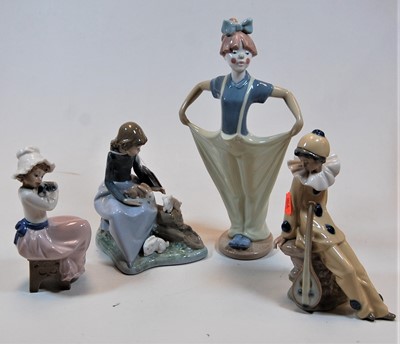 Lot 247 - A Nao porcelain figure of a young clown,...