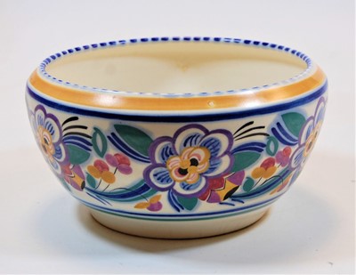 Lot 216 - A Poole Pottery bowl, the frieze typically...