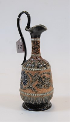 Lot 236 - A Victorian Doulton stoneware ewer, on a...