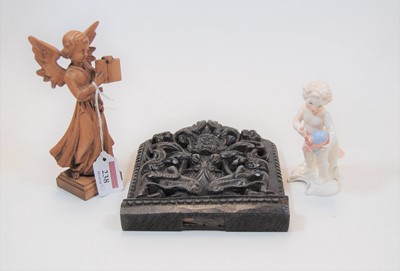 Lot 238 - A small carved oak panel, depicting a central...