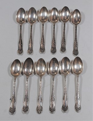 Lot 415 - A set of twelve George V silver teaspoons,...