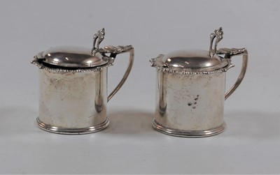 Lot 420 - A pair of George V silver mustards, each...