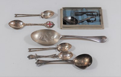 Lot 423 - A George V silver serving spoon; together with...