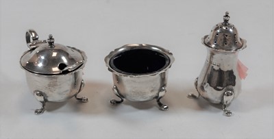 Lot 429 - A George V silver three-piece cruet set,...