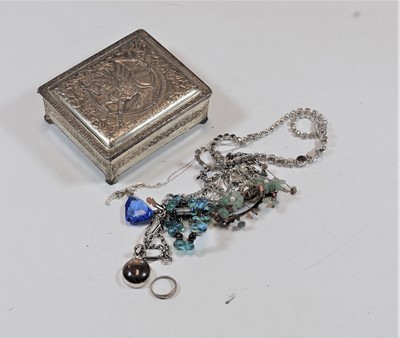 Lot 447 - A base metal trinket jar and cover, the hinged...