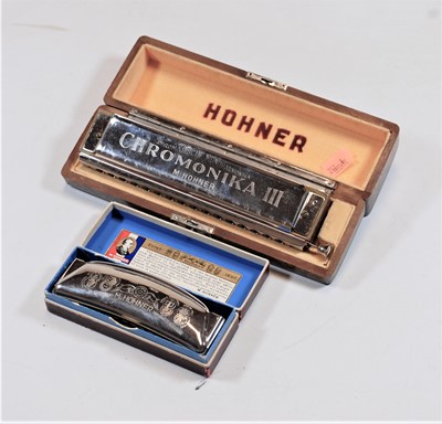 Lot 458 - A Hohner chromonika 3 harmonica in fitted case,...