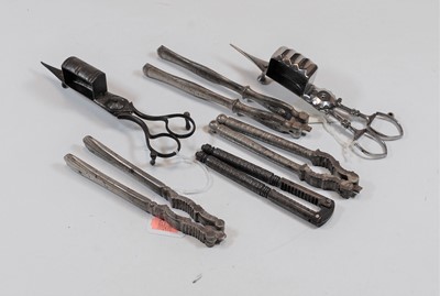 Lot 459 - A pair of George III steel candle snuff...