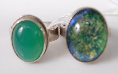 Lot 322 - Two modern silver and cabachon set dress rings,...