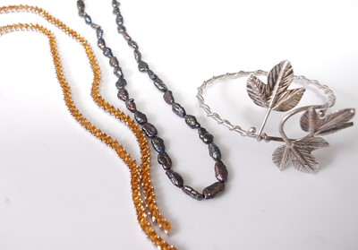 Lot 389 - A contemporary natural black pearl necklace...