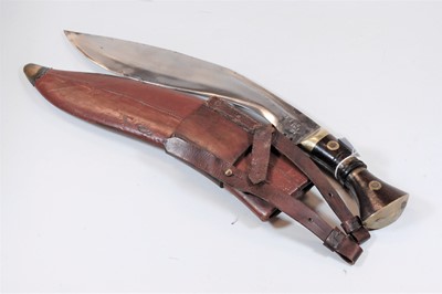 Lot 549 - A 20th century kukri with leather scabbard