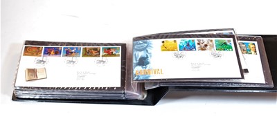 Lot 570 - An album containing a collection of first day...
