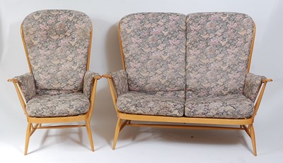 Lot 351 - An Ercol light elm three-piece lounge suite,...