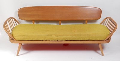 Lot 350 - A 1960s Ercol light elm three-seater...