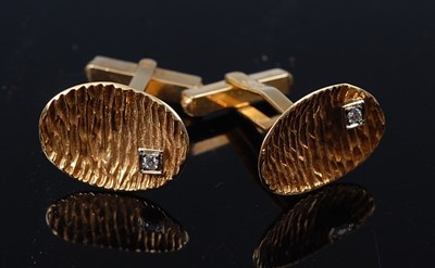 Lot 1264 - A pair of yellow metal cufflinks, each...